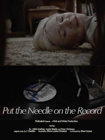 The upper half of the image features a person with short bleach-blonde hair laying their head on a shaggy grey carpet. Their eyes are closed and their eyebrows raised, seemingly in reaction to something which is happening out of frame. The lower half of the image features a vinyl record being played on a turntable. Just below the record is the title of the film, "Put the Needle on the Record." Beneath the title is a bunch of smaller text with various credits for cast and crew.